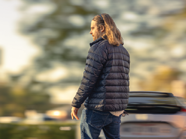photo of a man in focus with a blurry background
